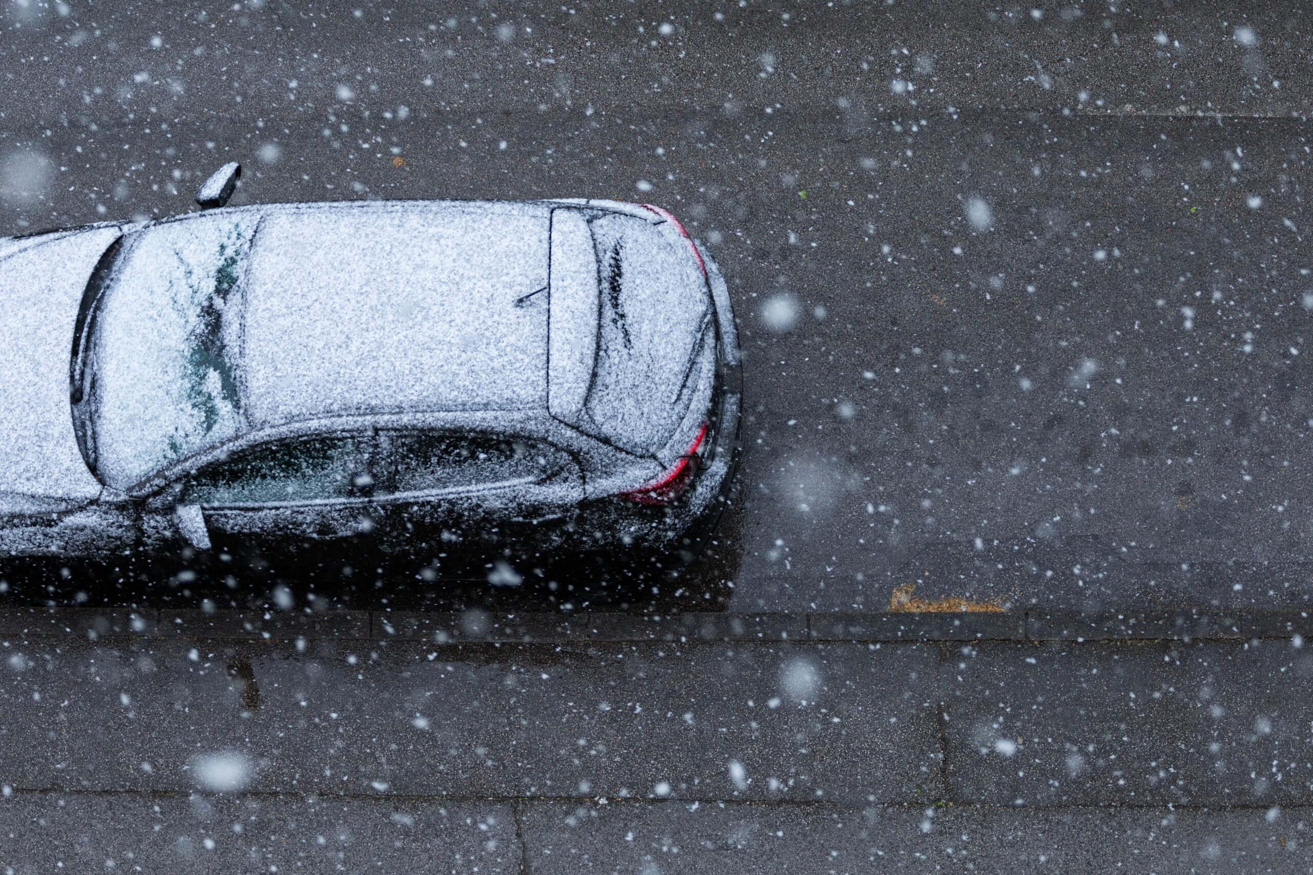 black_car_under_the_snow